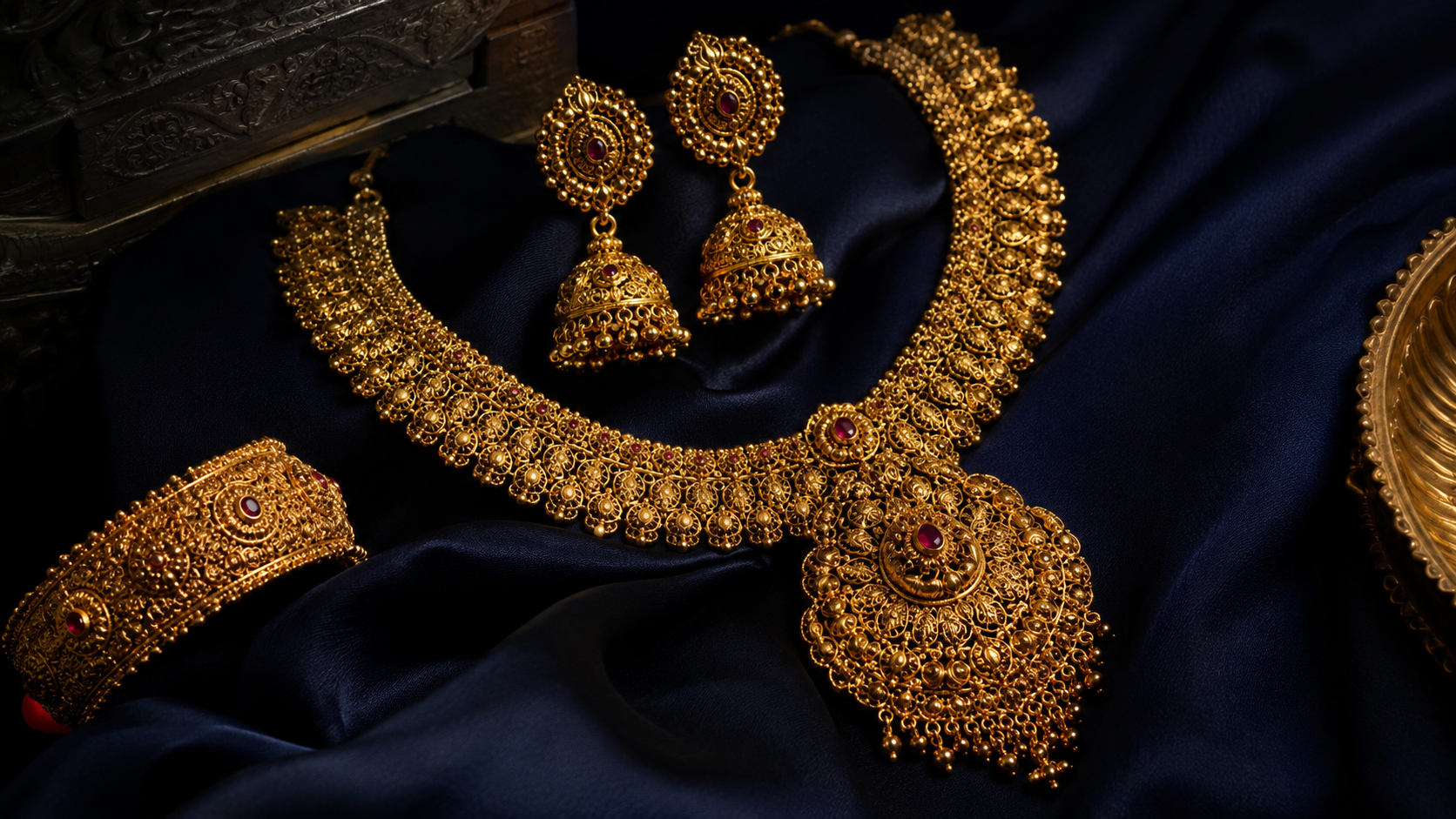 Traditional Indian gold wedding jewellery on a silk cloth